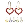 Aretes con forma de corazón bordado con cristales