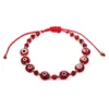 Pulsera de hilo con cristales rojos y ojitos turcos