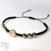 Pulsera tejida con dije de San Benito