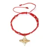 Pulsera tejida con dije nudo de bruja