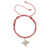 Pulsera tejida con dije nudo de bruja